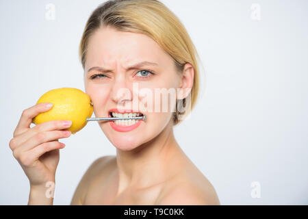 Energy source and vitality. healthy skin. energy of girl with lemon charging. Recharge your body vitamins. fresh fruit juice. lemon battery. woman with hobnail at lemon. vitamin diet food. skincare. Stock Photo