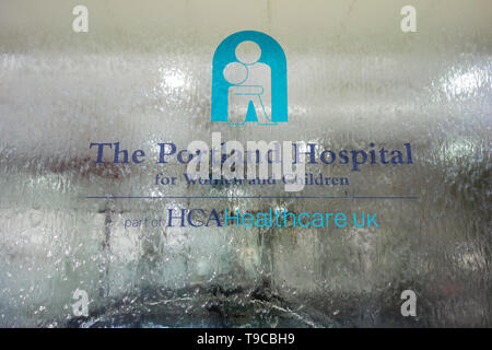 Entrance signage outside The Portland Hospital for Women and Children, HCA Healthcare, Great Portland Street, London, W1, UK Stock Photo