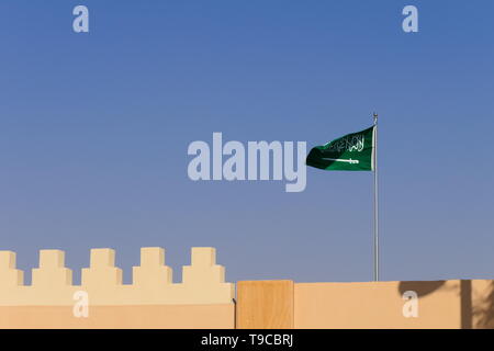 The flag of the Kingdom of Saudi Arabia waving in the historic Diriyah Stock Photo