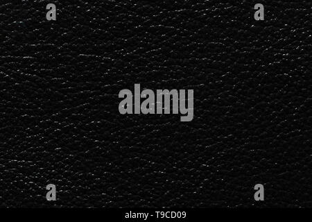Extravagant leather background in black colour. Black leather texture. Stock Photo