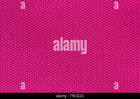 Perfective fabric background in pink colour close-up. Stock Photo