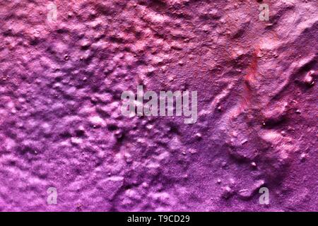 High resolution texture of colorful graffiti paint on conrete and brick walls in red blue purple and silver Stock Photo