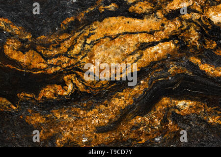 Close up of detailed red and black natural marble stone texture. Stock Photo