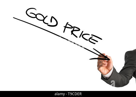 Lower gold price theme with downward arrow and text written by unidentifiable of business man in suit over white background. Stock Photo