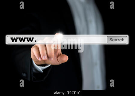 Businessman pushing a search bar on a virtual computer screen. Empty space ready for your web address or keywords. Stock Photo