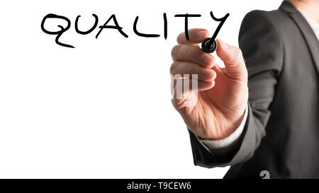 Male hand writing Quality on virtual whiteboard. Isolated over white background. Stock Photo