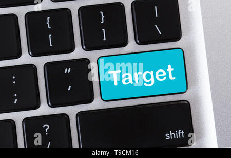 Target word on blue button of computer keypad Stock Photo