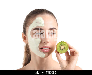 Beautiful young woman with kiwi facial mask on white background Stock Photo