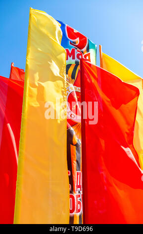 Samara, Russia - May 10, 2019: Colorful holiday flags fluttering against the blue sky in Victory Day Stock Photo
