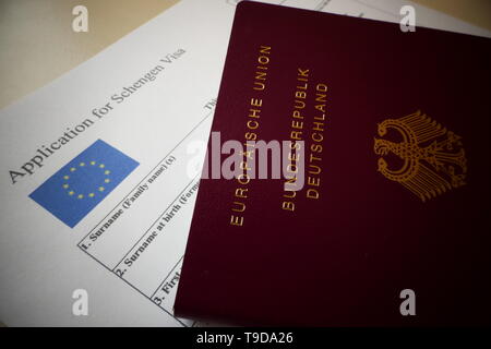 Visa application form, passport, stamp and USA flag on table. Concept ...