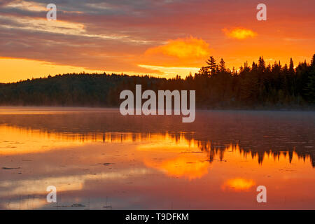 Sunrise reflection on Lac du fou La Mauricie National Park Quebec Canada Stock Photo