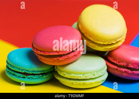 French delicate dessert for Breakfast in the morning. Closeup of colorful macaroons on the table Stock Photo