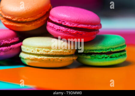 Close up of macro photo of French dessert, fresh colored macaroons on the table Stock Photo