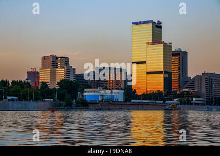 Crowne Plaza hotel building and the Moscow World Trade Center (WTC) at the Moskva river bank during sunset. Moscow, Russia. Stock Photo