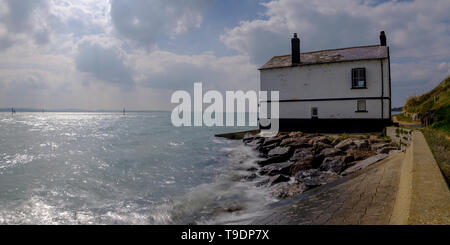 Lepe, UK - April 7, 2019:  The Old Coast Guard watch cottages on the foreshore of the New Forest National Park in Hampshire, UK Stock Photo