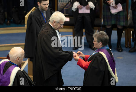 Former moderator Very Rev Susan Brown (right) consecrates the new moderator Rt Rev Colin Sinclair during the opening ceremony of the Church of Scotland 2019 General Assembly at the Assembly Hall, Edinburgh. Stock Photo