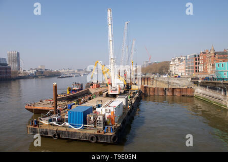 Construction work on the River Thames in London, England Stock Photo
