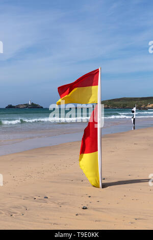 Beach lifeguard flags on sunny beach with copy space Stock Photo