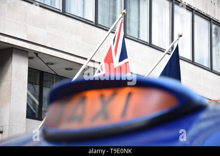 Closeup to a London Taxi Sign in UK - neon sign of a London Taxi Stock Photo