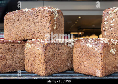 Loaves of brown bread stacked up and ready for breakfast Stock Photo