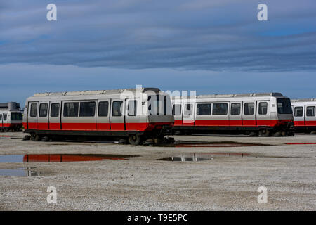 Chicago, IL, United States - May 7, 2019: Retired ATS wagons from Chicago's O'Hare Airport sitting in one of the empty lots behind the airport termina Stock Photo