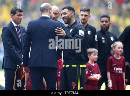 The Duke of Cambridge (centre right) shakes hands with Watford's Troy Deeney (right) at the start of the FA Cup Final at Wembley Stadium, London. Stock Photo