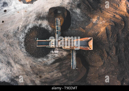 Aerial photo of a dirt and soil screener (sorter) taken from above on a construction site at sunset Stock Photo