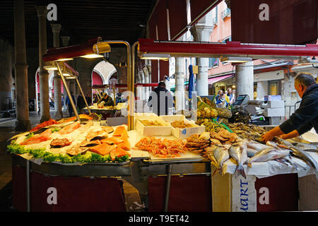 VENICE, ITALY -8 APR 2019- Fresh seafood for sale at the Rialto farmers market (Mercato di Rialto) in Venice, near the Rialto Bridge and the Grand Can Stock Photo