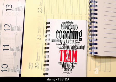 Team word cloud collage over notepad background Stock Photo