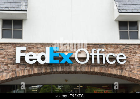 Collegeville, PA - May 9, 2019: FedEx Office logo sign above the entrance to a retail location for the Federal Express shipping company. Stock Photo