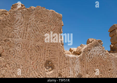Israel, historic Masada aka Massada. UNESCO. Ruins of Byzantine Church, circa fifth and sixth centuries. Ornate walls decorated with old pottery shard Stock Photo