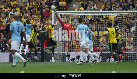 London, UK. 18 May 2019 Watfords Heurelho Gomes punches the ball clear during the Emirates FA Cup Final between Manchester City and Watford at the Wembley Stadium in London. 18 May 2019. EDITORIAL USE ONLY. No use with unauthorized audio, video, data, fixture lists, club/league logos or 'live' services. Online in-match use limited to 120 images, no video emulation. No use in betting, games or single club/league/player publications. Credit: James Boardman / Alamy Live News Stock Photo