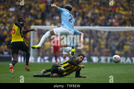 London, UK. 18 May 2019 Watfords Etienne Capoue slides into tackle Manchester City's Kyle Walker during the Emirates FA Cup Final between Manchester City and Watford at the Wembley Stadium in London. 18 May 2019. EDITORIAL USE ONLY. No use with unauthorized audio, video, data, fixture lists, club/league logos or 'live' services. Online in-match use limited to 120 images, no video emulation. No use in betting, games or single club/league/player publications. Credit: James Boardman / Alamy Live News Stock Photo
