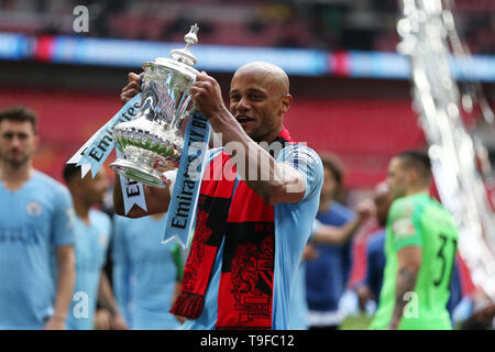 Vincent Kompany of Manchester city lifts the FA Cup trophy after the match. The Emirates FA Cup final, Manchester City v Watford at Wembley Stadium in London on Saturday 18th May 2019.  this image may only be used for Editorial purposes. Editorial use only, license required for commercial use. No use in betting, games or a single club/league/player publications . pic by Andrew Orchard/Andrew Orchard sports photography/Alamy Live news Stock Photo