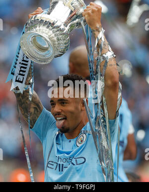 London, UK. 18th May, 2019. Manchester City's Gabriel Jesus celebrates after winning the English FA Cup Final between Manchester City and Watford at Wembley Stadium in London, Britain on May 18, 2019. Manchester City won 6-0 and became the first English men's side to achieve the feat of winning the Premier League, FA Cup and Carabao Cup in the same season. Credit: Han Yan/Xinhua/Alamy Live News Stock Photo