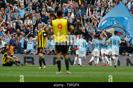 London, UK. 18th May, 2019. Manchester City's Kevin De Bruyne (3rd R) celebrates after scoring during the English FA Cup Final between Manchester City and Watford at Wembley Stadium in London, Britain on May 18, 2019. Manchester City won 6-0 and became the first English men's side to achieve the feat of winning the Premier League, FA Cup and Carabao Cup in the same season. Credit: Han Yan/Xinhua/Alamy Live News Stock Photo