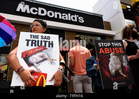 Los Angeles, USA. 18th May, 2019. Animal rights activists seen holding placards during a protest of what they called, animal cruelty in the chicken supply chain of McDonalds. The protest took place in front of a McDonalds fast food restaurant on the Hollywood Walk of Fame in Los Angeles. Credit: SOPA Images Limited/Alamy Live News Stock Photo