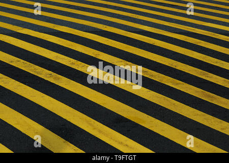 Striped black and yellow grunge background, warning signage. Stock Photo
