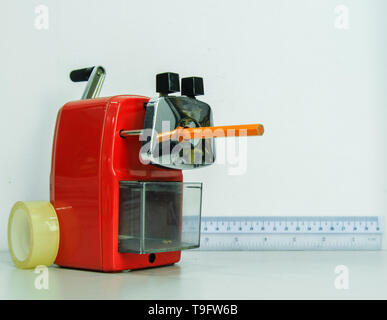 Red pencil sharpener machine on white background Stock Photo