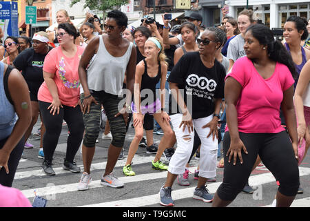 people doing zumba in the streets Stock Photo