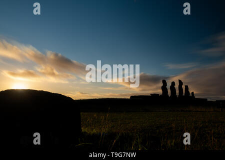 Moai shilouette in the Ahu Tahai at sunset, profile view Stock Photo