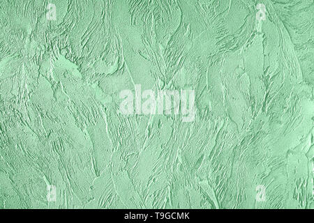 Trendy mint colored rouge concrete textured background for concept or product. Toned image. Stock Photo