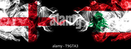 English vs Lebanon, Lebanese smoky mystic flags placed side by side. Thick colored silky smokes flag of England and Lebanon, Lebanese. Stock Photo