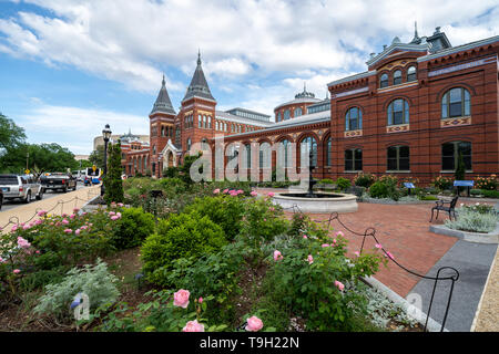 Washington, DC - May 9, 2019: Exterior of the Smithsonian Castle, with a rose garden and patio on the National Mall Stock Photo