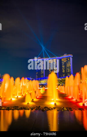 SINGAPORE CITY, SINGAPORE - MARCH 2, 2019: Spectra Light and Water Show Marina Bay Sand Casino Hotel Downtown Singapore Stock Photo