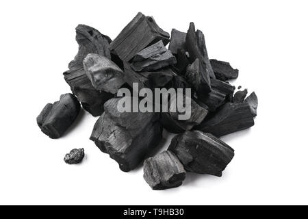 Natural hardwood charcoal isolated on white background. Stock Photo