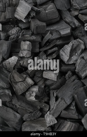 Black charcoal texture background. Close-up shot. Top view. Stock Photo