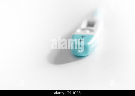 Electronic body temperature thermometer isolated on white background Stock Photo