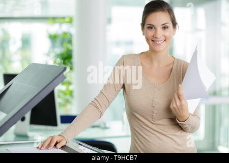 woman doing photocopies in the office Stock Photo