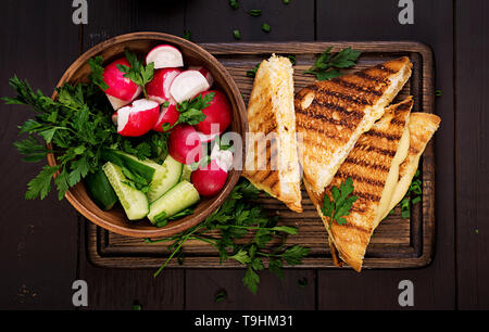 American hot cheese sandwich. Homemade grilled cheese sandwich for breakfast. Top view Stock Photo